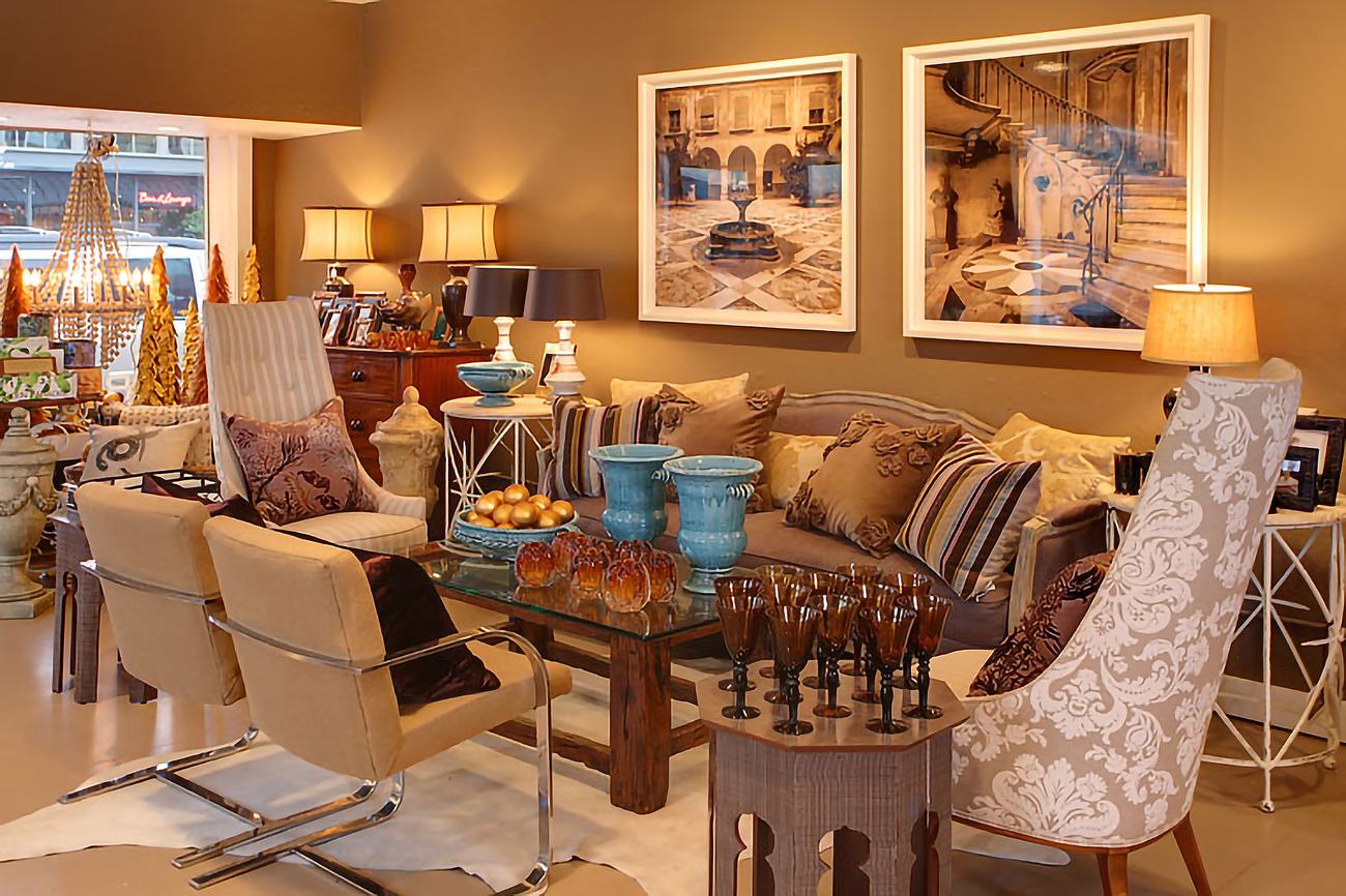 The Bellevue showroom, seating arranged beneath framed prints.